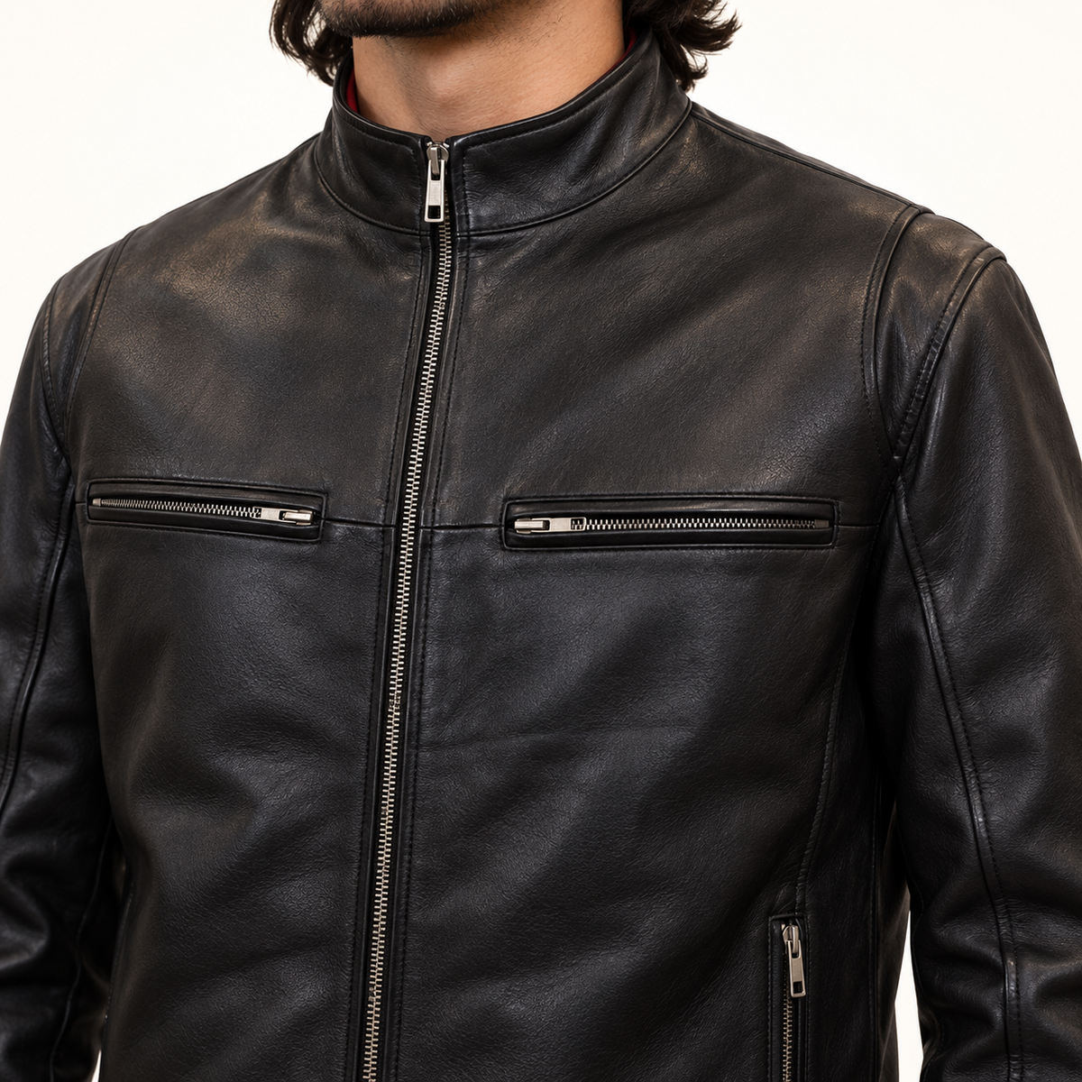 Close-up of front zippered chest pockets on black cafe racer leather jacket