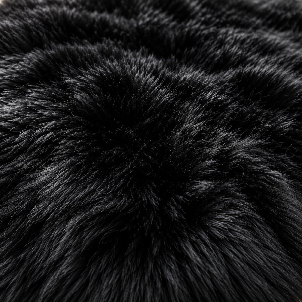 Macro close-up of dense black fur texture on ZOQ Leather floor mat