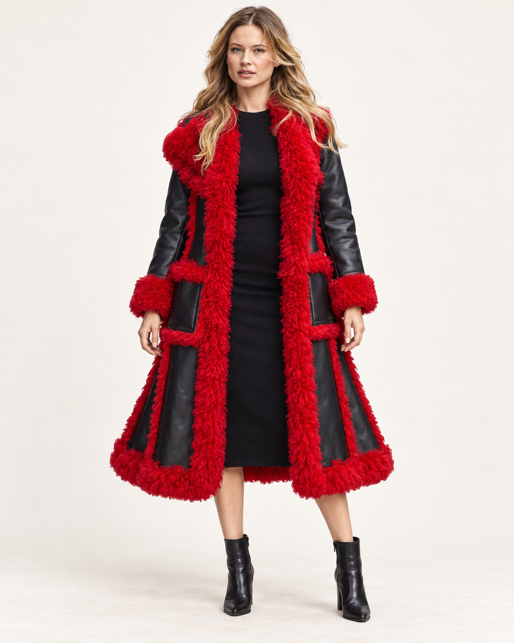 Woman wearing red faux shearling trench coat, front studio view