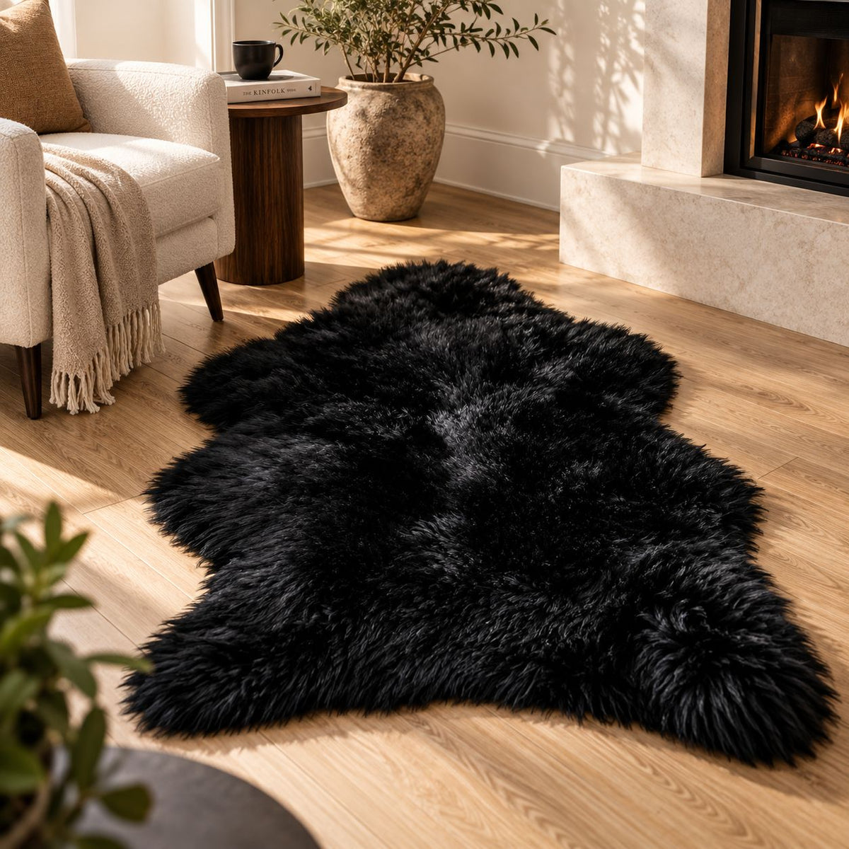 Black fur floor mat placed beside a fireplace in a cozy living room